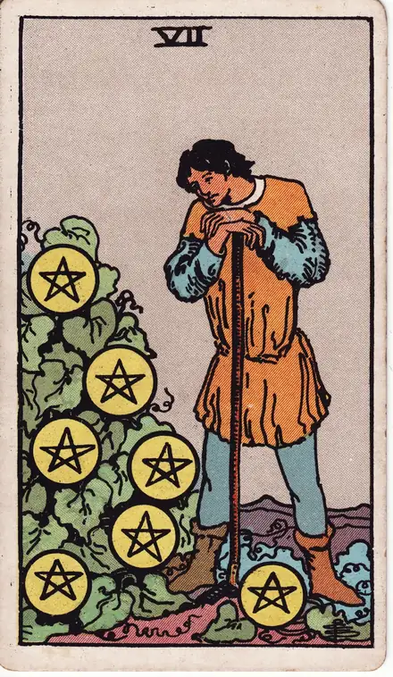 Seven of Pentacles — Rider–Waite–Smith, 1909
